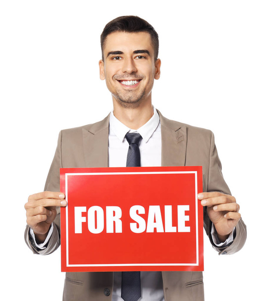  real estate agent holding "For sale" sign - Foto, imagen