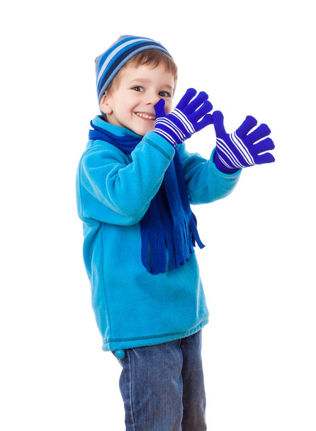 Boy in winter clothes with long nose sign - Фото, изображение
