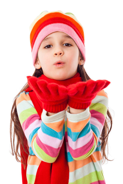 Girl in warm winter clothes blowing to hands - Fotoğraf, Görsel