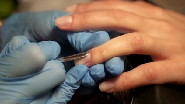 Receiving cuticle removing procedure with nail tools. - Footage, Video