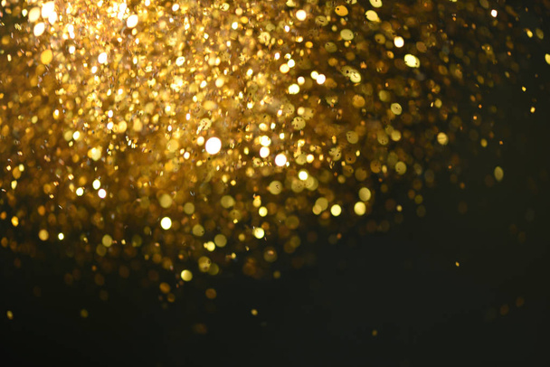 golden glitter texture Colorfull Blurred abstract background for birthday, anniversary, wedding, new year eve or Christmas. - Фото, зображення