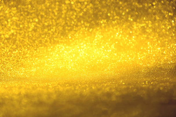 golden glitter texture Colorfull Blurred abstract background for birthday, anniversary, wedding, new year eve or Christmas. - Photo, image