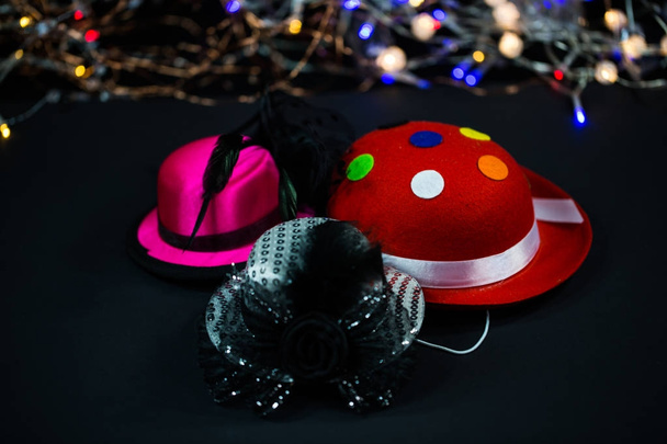 Hats on black background, carnival hats, party hats - Photo, Image