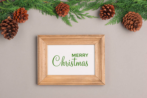 Christmas background with frame, cones and gift boxes  - Photo, Image