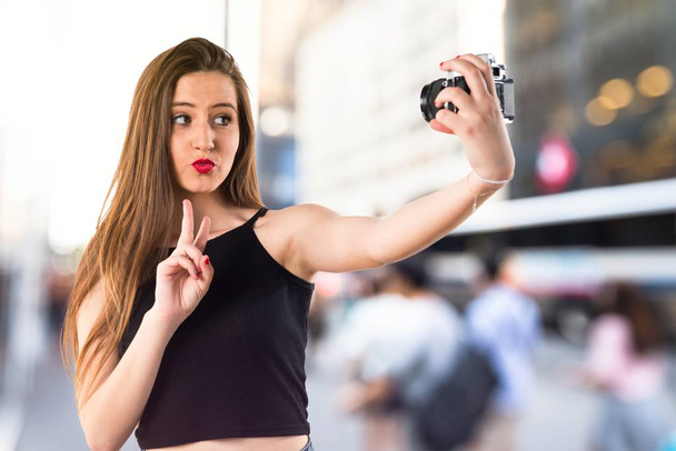 Young girl making a selfie - Photo, Image
