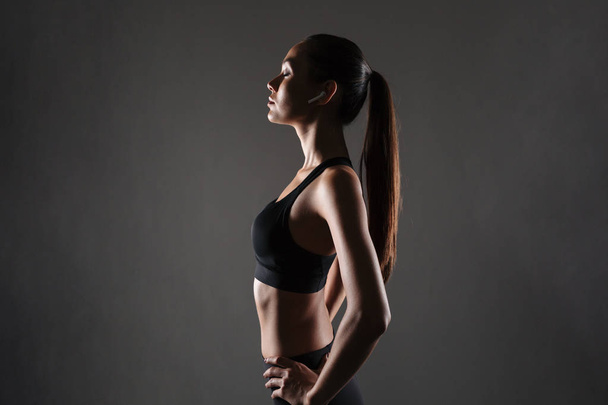 Side view portrait of a young asian fitness woman - Photo, Image