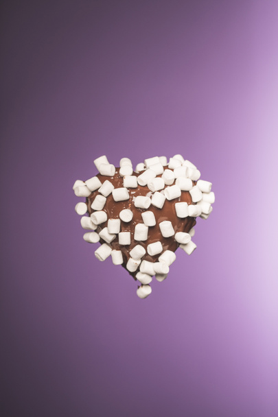 chocolate heart shaped candy with marshmallow isolated on purple - Foto, immagini