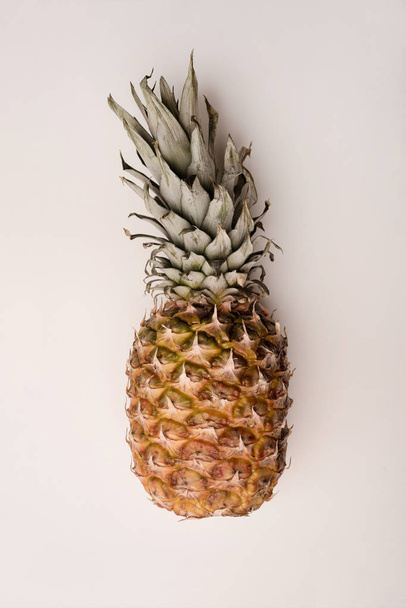 Close up of ripe pineapple isolated over white - Foto, Bild