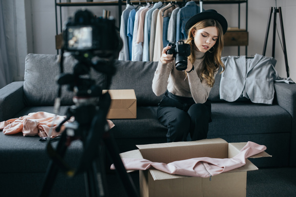 young fashion blogger recording video about dress for new vlog - Fotoğraf, Görsel