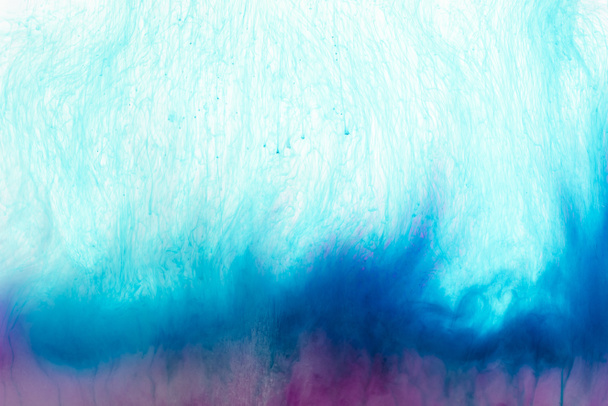 close up view of pink and blue paint splashes - Фото, изображение