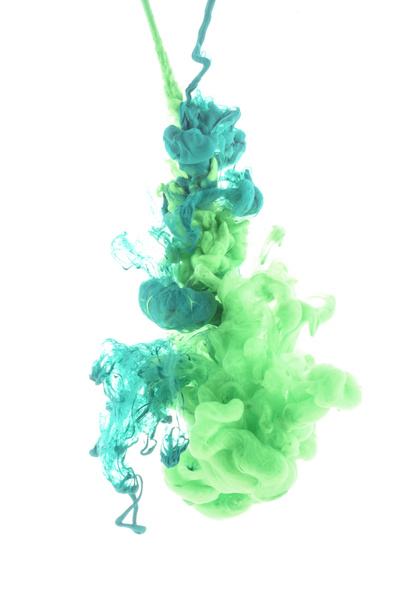 mixing of green paint splashes isolated on white - Foto, afbeelding