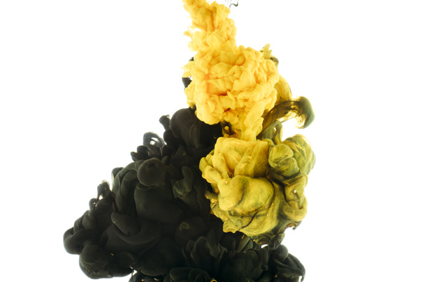 mixing of black and yellow paint splashes, isolated on white - Photo, Image