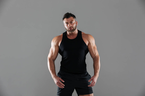 Portrait of a confident serious male bodybuilder - Photo, image