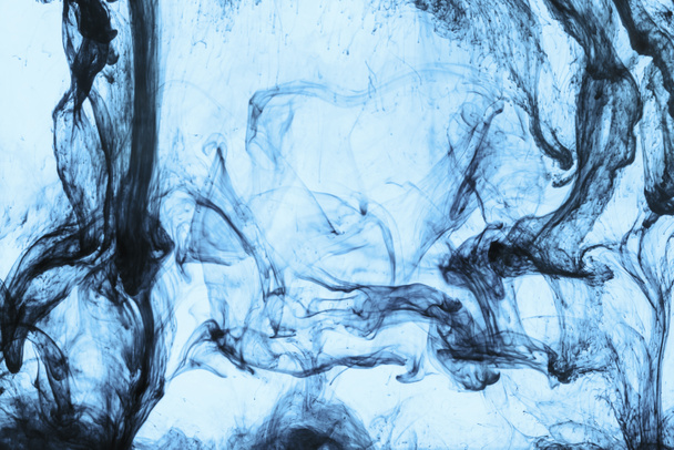 background with swirls of blue paint in water - Foto, Imagem
