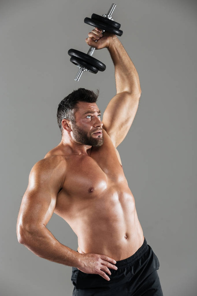 Portrait of a healthy strong shirtless male bodybuilder - Фото, зображення
