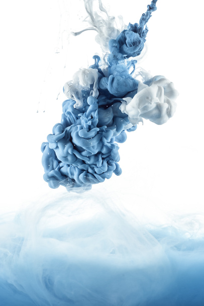 close up view of mixing of blue and white paint splashes isolated on white - Fotografie, Obrázek