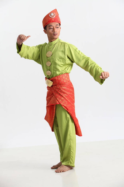 malay male performing martial art in studio - Photo, image