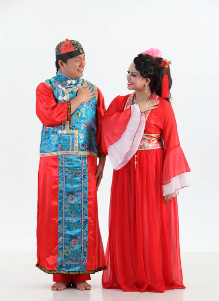 Chinese couple with traditional costumes posing in studio  - Foto, Imagen