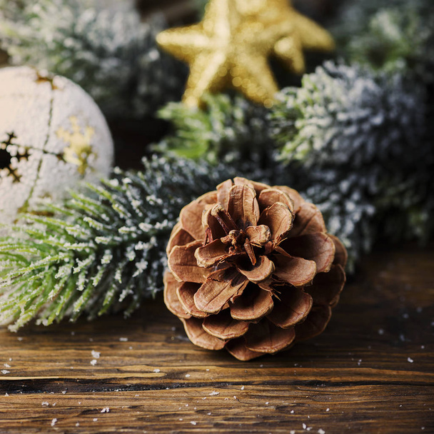 Concept of Christmas card on the wooden background, selective focus and square image - 写真・画像