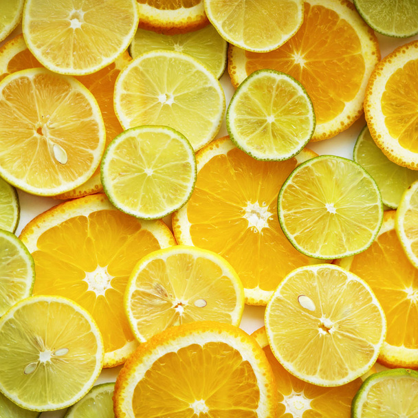スライスした柑橘類、オレンジ色の壁紙がたくさん  - 写真・画像