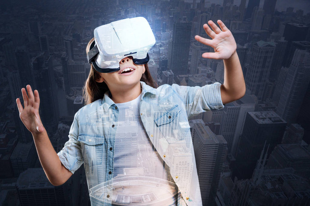 little girl using a VR headset - Фото, зображення
