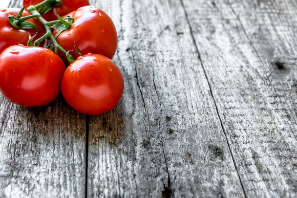 Fresh tomatoes, organic vegetables from local market on farmer table - Fotografie, Obrázek