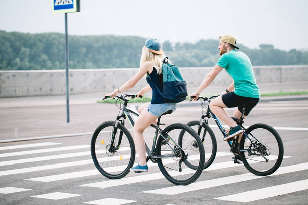 Couple of romantic lovers cycling people, love, nature and lifestyle concept - Photo, Image