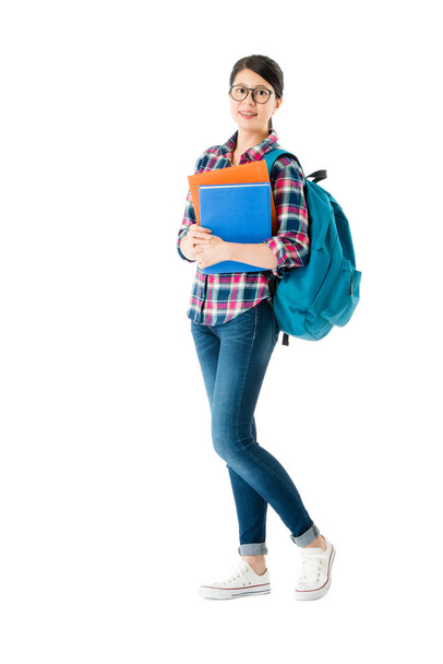 female student standing on white wall background - Photo, image