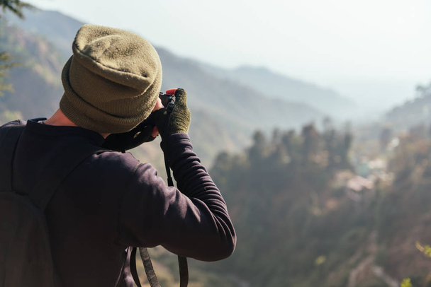 Man take a photo in mountains - Photo, Image