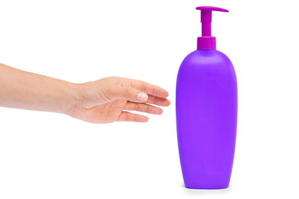 Hand holding shampoo bottle isolated on white background - Photo, image