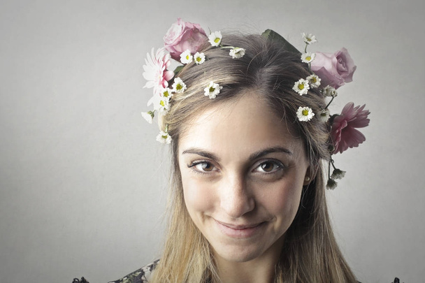 Girl with flowers in her hair - Fotó, kép