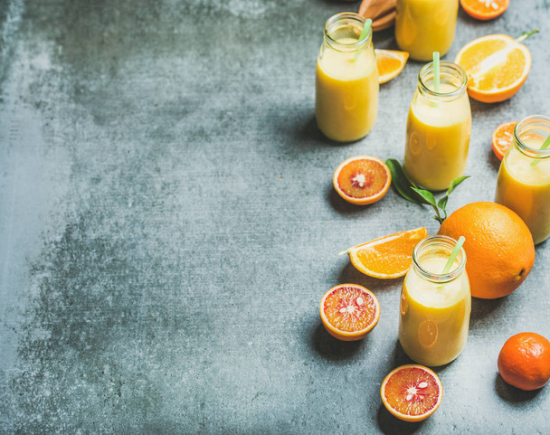 Healthy yellow smoothie in bottles - Photo, image
