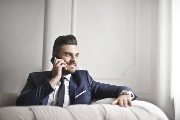 Businessman doing a phone call  - Foto, afbeelding