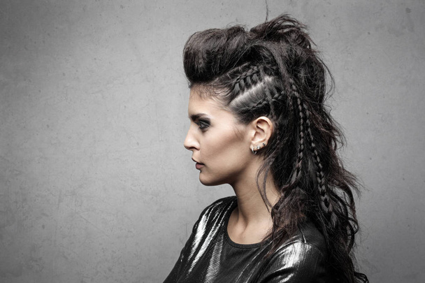 Portrait of a young woman with an elaborate hairstyle - Foto, Imagem