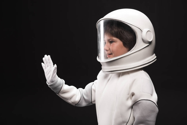 Kindness small astronaut is welcoming someone - Foto, Imagen