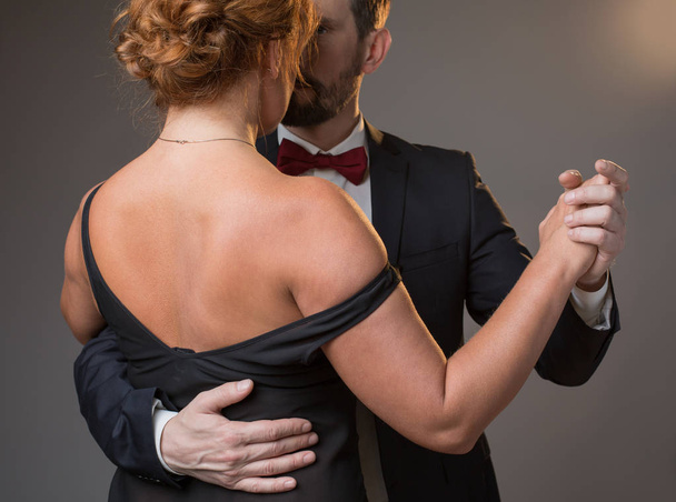 Sensual loving couple expressing their passion in dance - 写真・画像