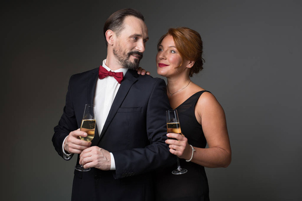Glad man and woman celebrating their anniversary - Zdjęcie, obraz