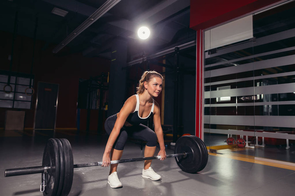 Cross fit woman in the gym - Photo, image