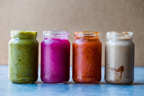 Jar of Beet Dip Sauce, Almond Butter or Tahini Pistachio Urbech and Salsa (Tomato Paste) Sauce - Photo, image