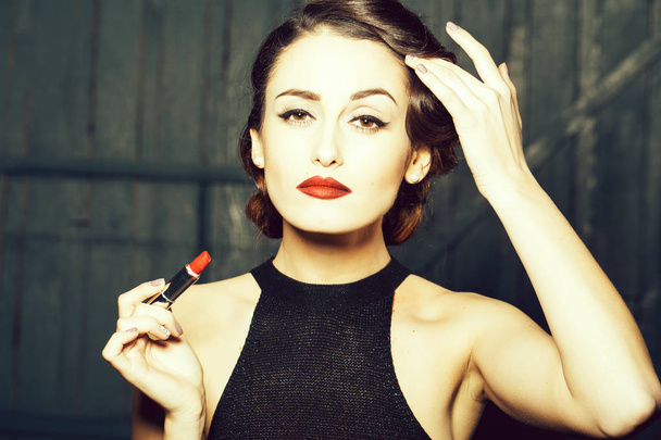 Young retro woman with lipgloss - 写真・画像