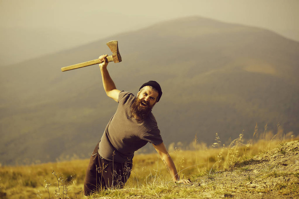 bearded man with ax on mountain - Zdjęcie, obraz