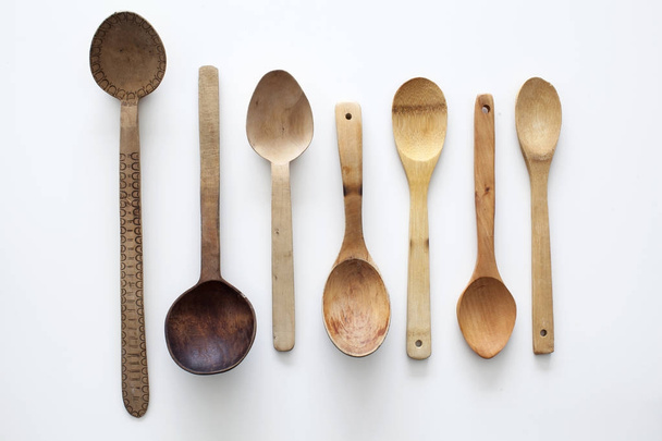 Old wood spoon on white background - Foto, imagen