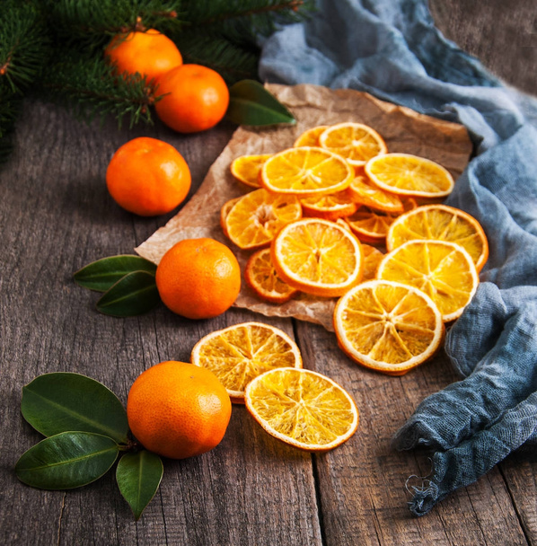 Dried oranges and fresh tangerines - Photo, Image