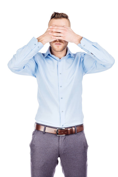 portrait young businessman covering his eyes with his hand. emot - Foto, Imagem