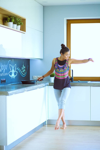 Fit and attractive young woman preparing healthy meal. Woman. - Foto, Imagen