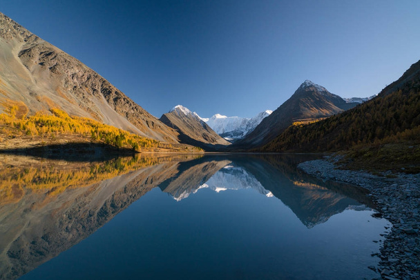 View from lake Akkem on mountain Belukha near board between Russia and Kazahstan during golden autumn - Photo, Image