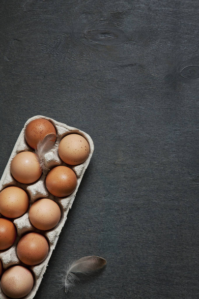 close-up of fresh homemade eggs on grey table.   - Foto, Imagen