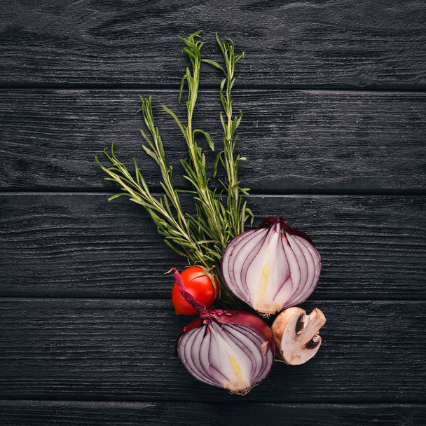 Vegetables. Onions, mushrooms, rosemary, cherry tomatoes. Top view. Free space for text. - Photo, Image