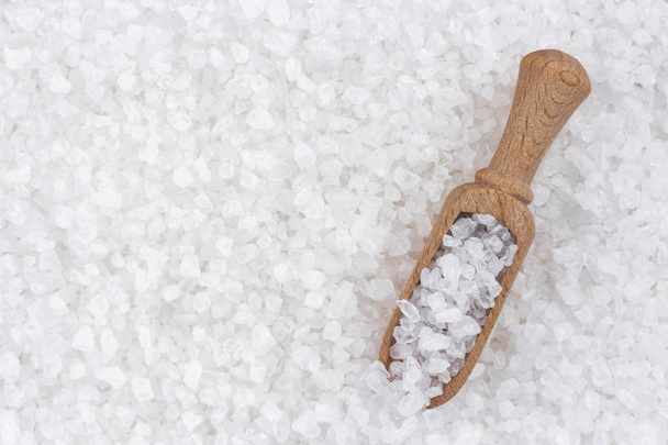 Sea salt background with wooden scoop - Photo, Image