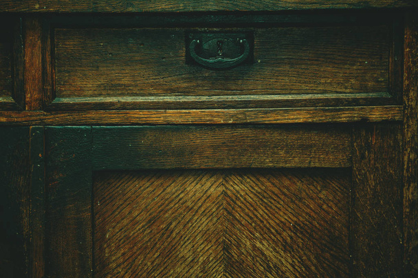 Detail of antique furniture. Background, the texture of a natural wood aged from time - Photo, Image